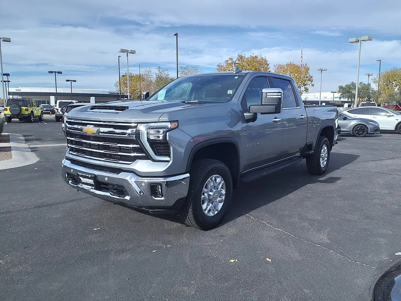 Grey 2024 Chevrolet Silverado 2500 HD LTZ Crew Cab, front three-quarter view
