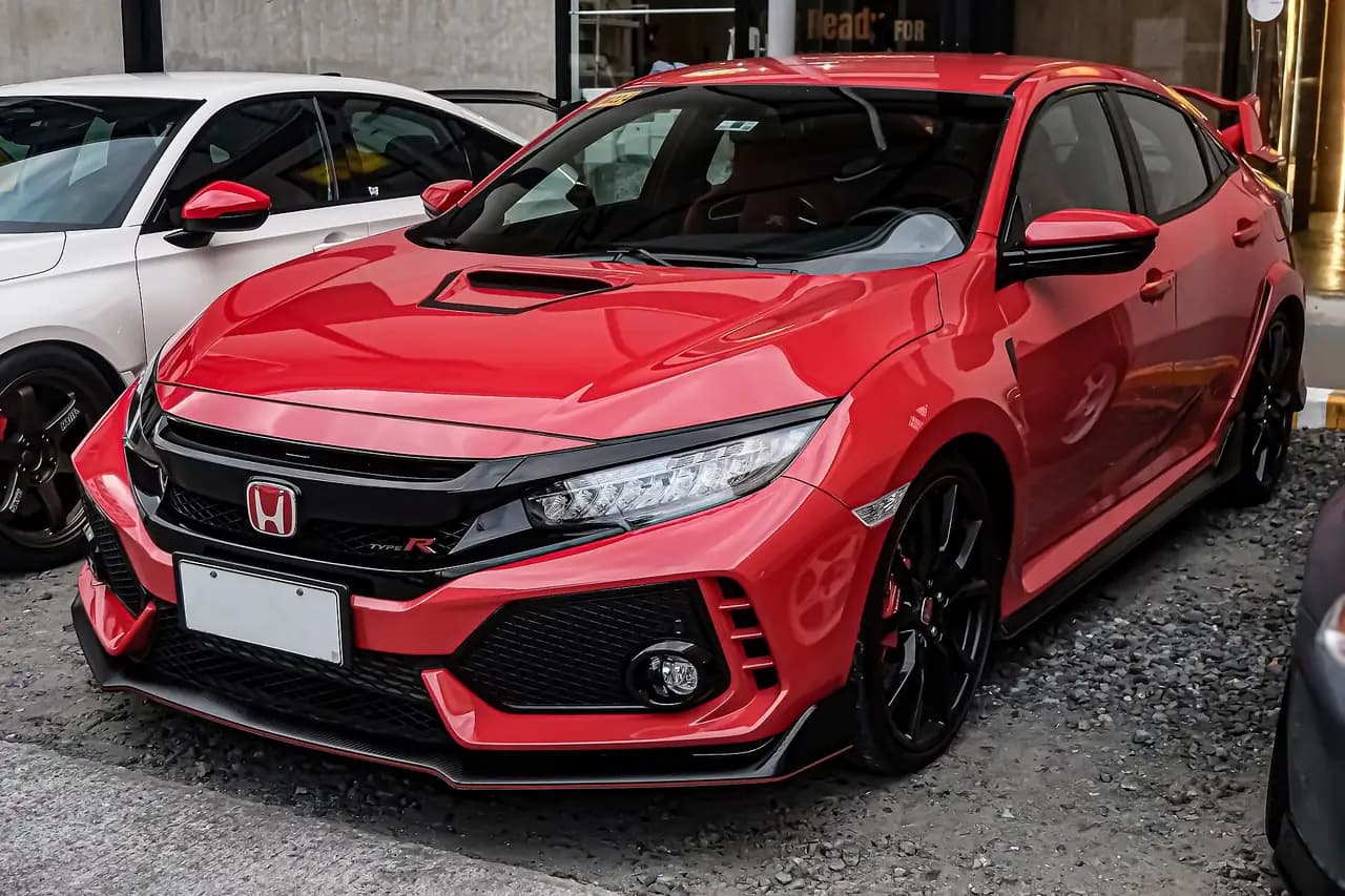 Red Honda Civic Type R (FK8) hatchback, pre-facelift, front three-quarter view