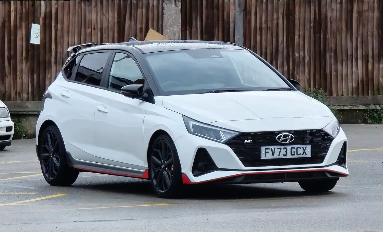 White 2023 Hyundai i20 N (BC3) with black roof, front three-quarter view