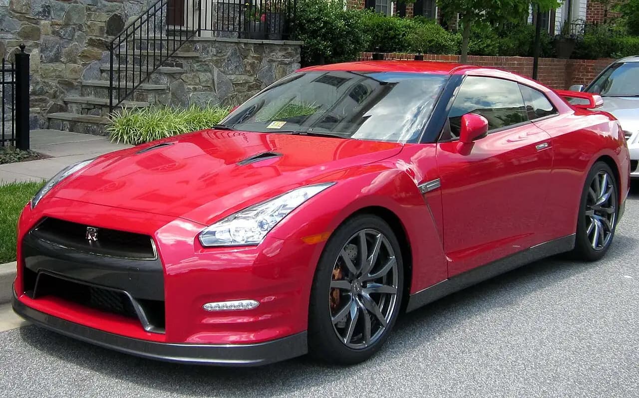 Red 2013 Nissan GT-R (R35 DBA) coupe, front three-quarter view