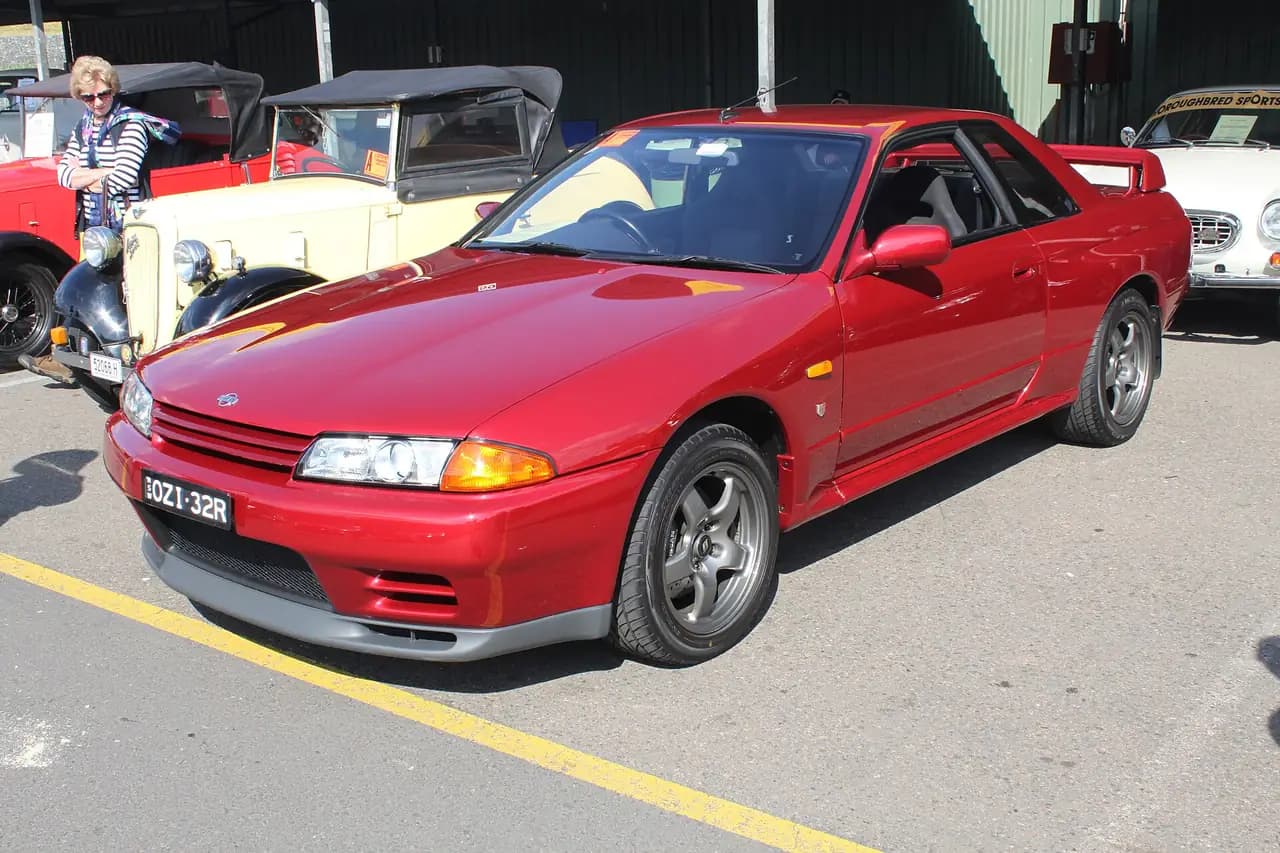 Red 1991 Nissan Skyline GT-R (R32) coupe, front three-quarter view