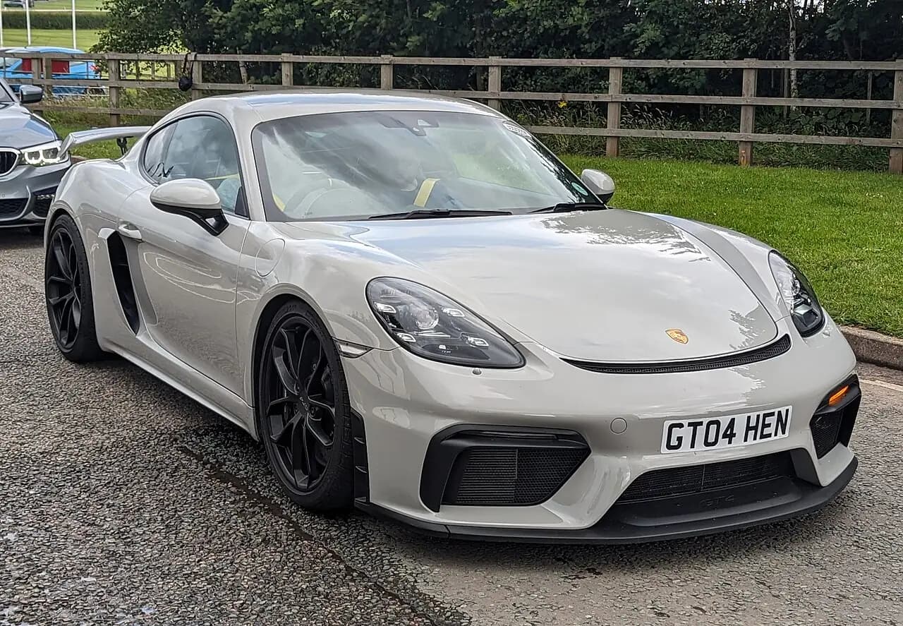Chalk grey Porsche 718 Cayman GT4 (982), front three-quarter view