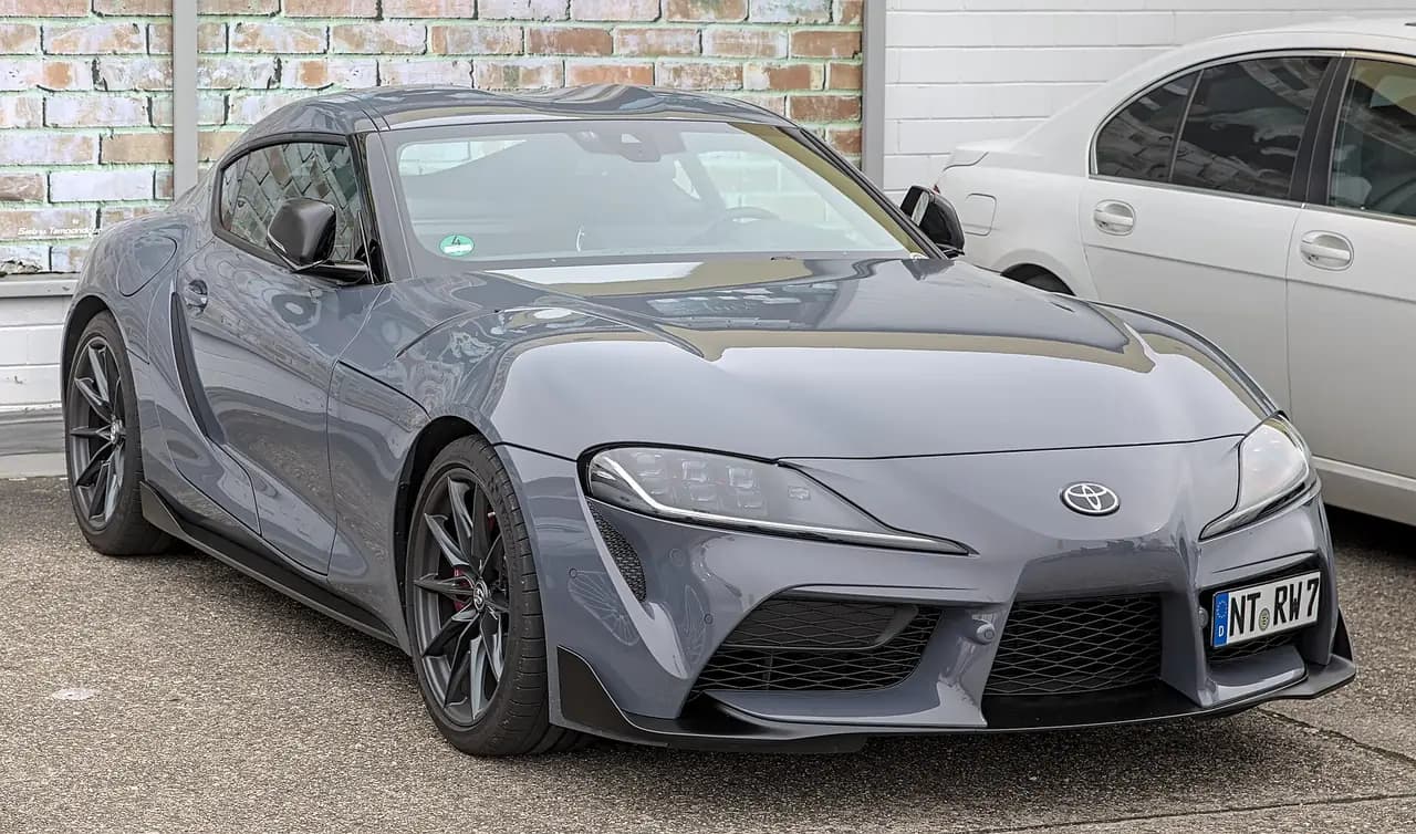 Grey Toyota GR Supra 3.0 (A90) coupe, front three-quarter view