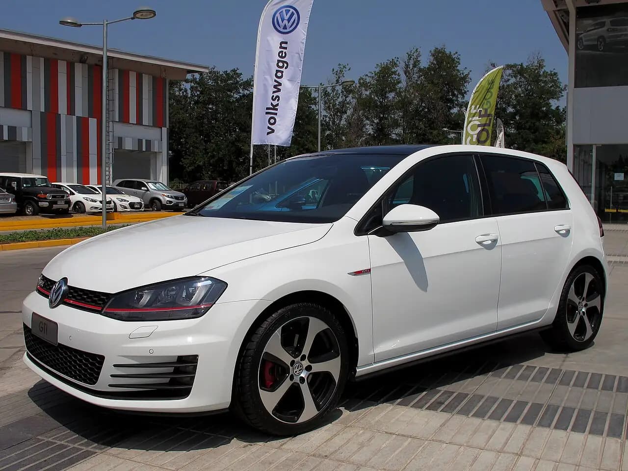 White 2015 Volkswagen Golf GTI (Mk7) 5-door hatchback, front three-quarter view