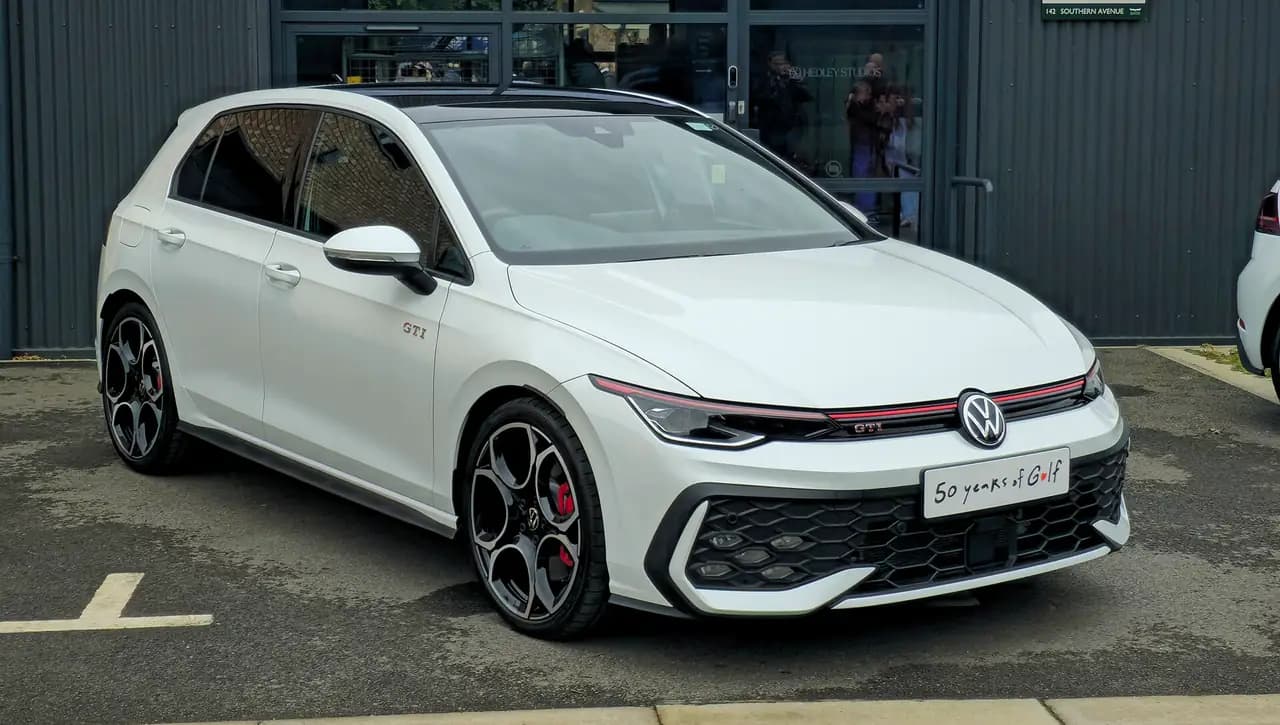 White Volkswagen Golf GTI (Mk8.5) hatchback, front three-quarter view