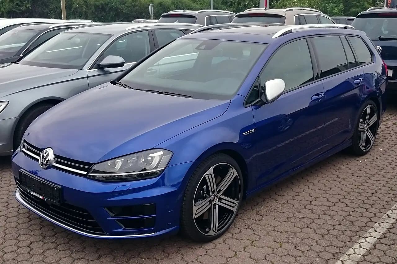Blue Volkswagen Golf R Variant (Mk7) wagon, front three-quarter view