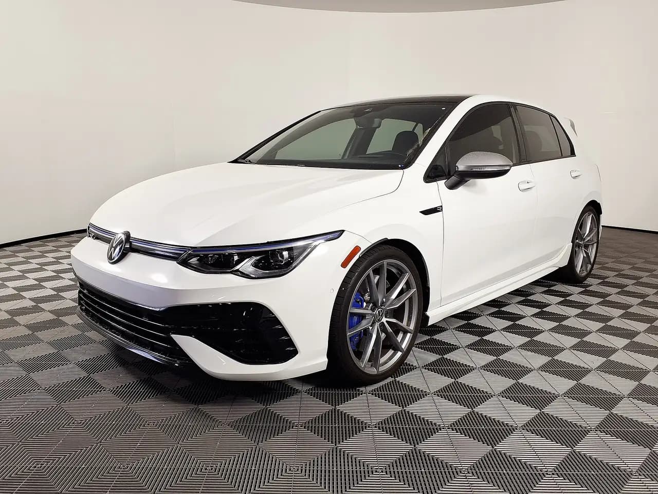 White 2024 Volkswagen Golf R (Mk8) hatchback, front three-quarter view