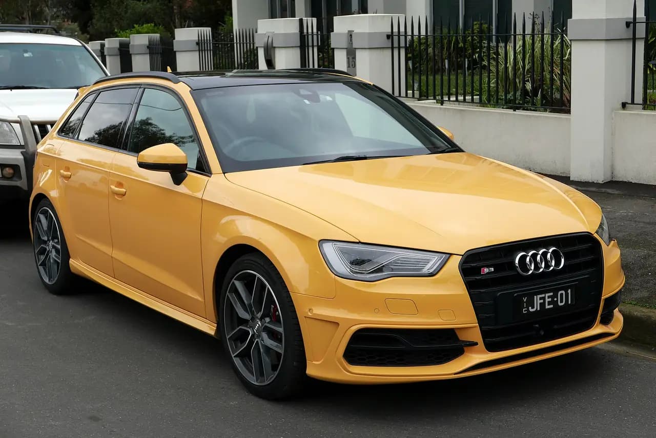 Yellow 2014 Audi S3 Sportback (8V), front three-quarter view