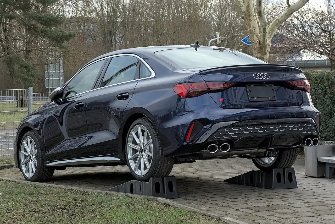 Dark blue Audi S3 Sedan (8Y facelift), rear three-quarter view