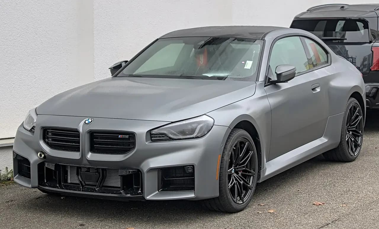 Matte grey 2025 BMW M2 Coupé (G87), front three-quarter view