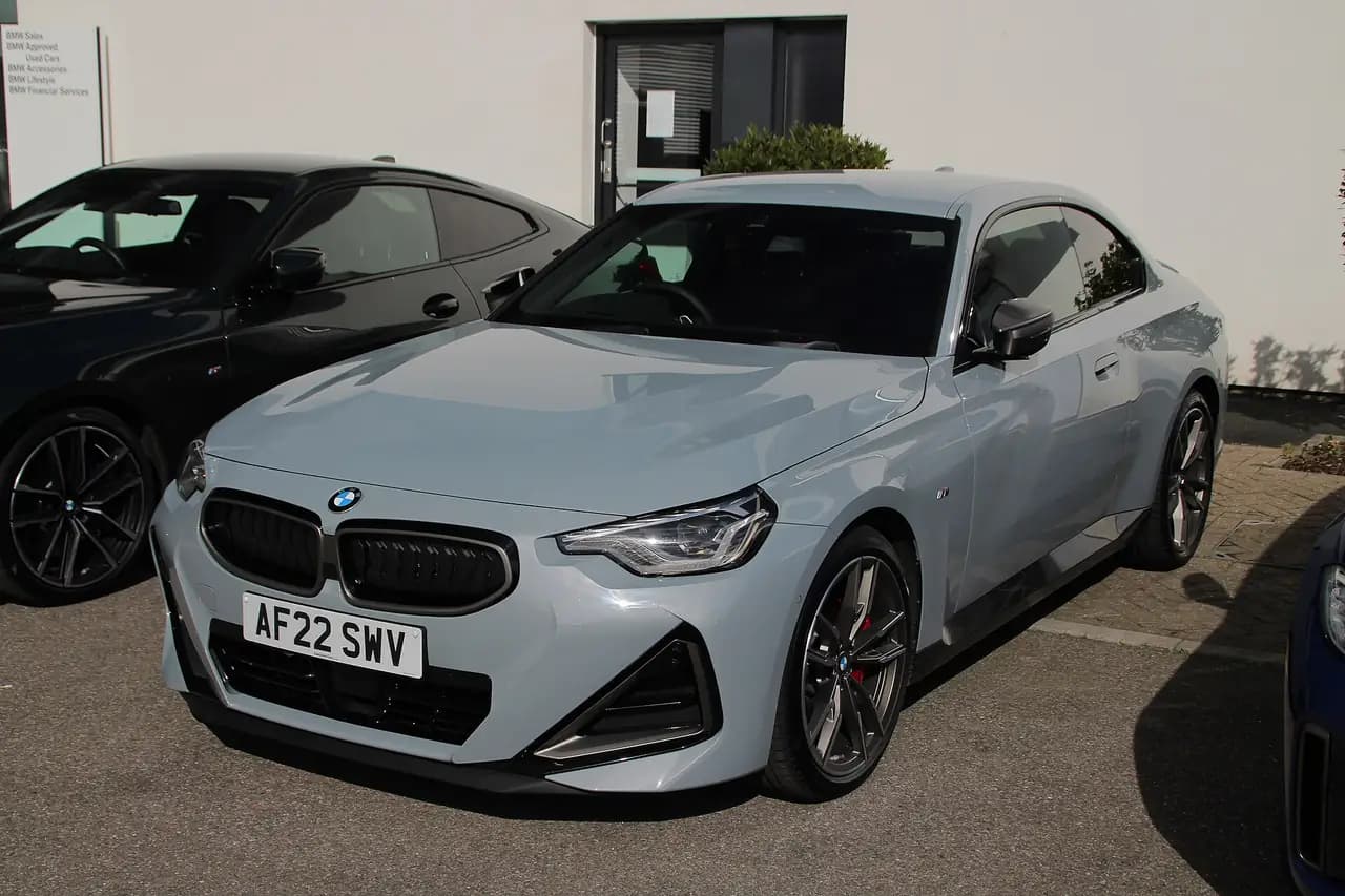 Grey 2022 BMW M240i xDrive Coupé (G42), front three-quarter view