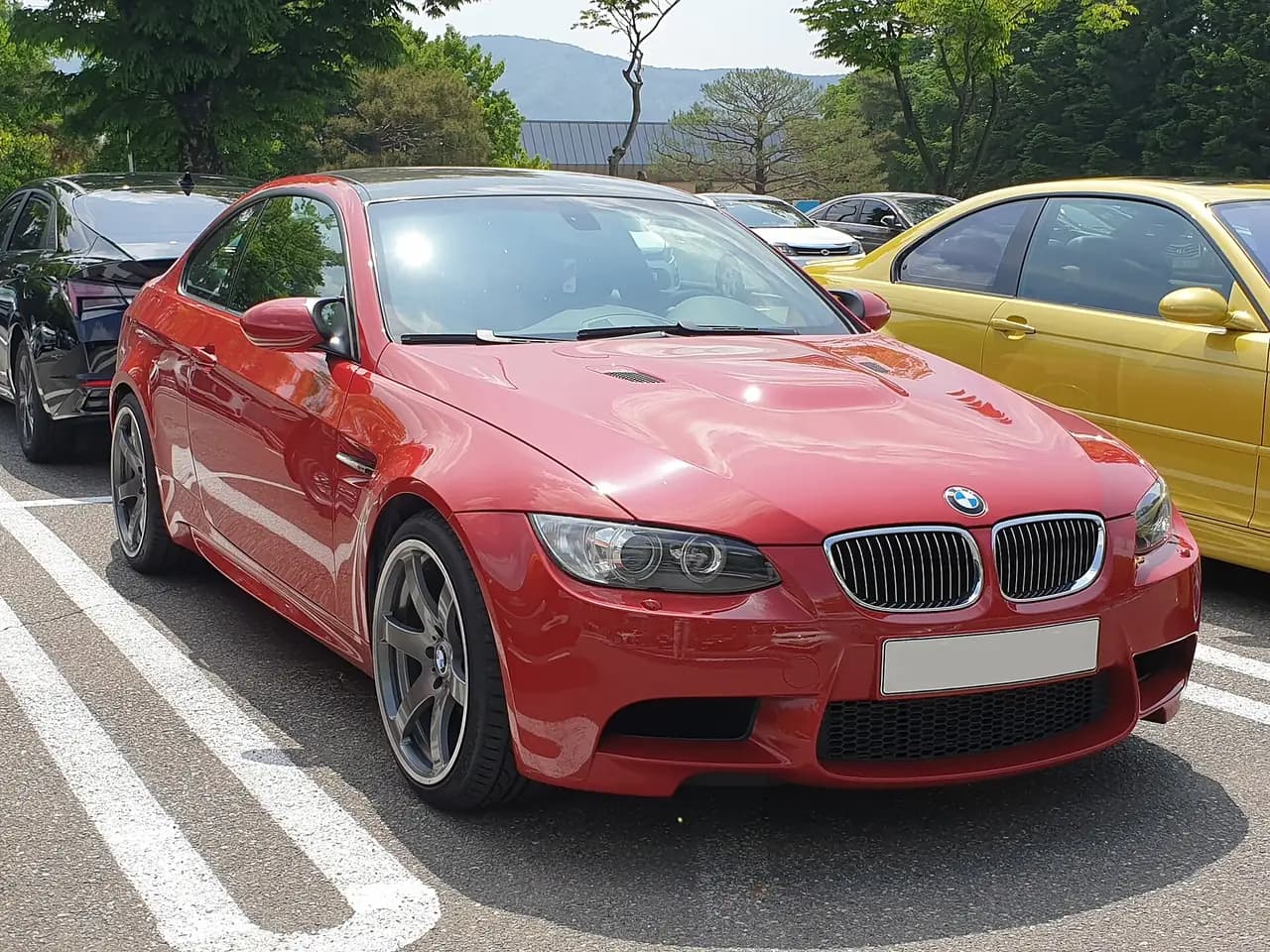 Melbourne Red BMW M3 coupe (E92), front three-quarter view