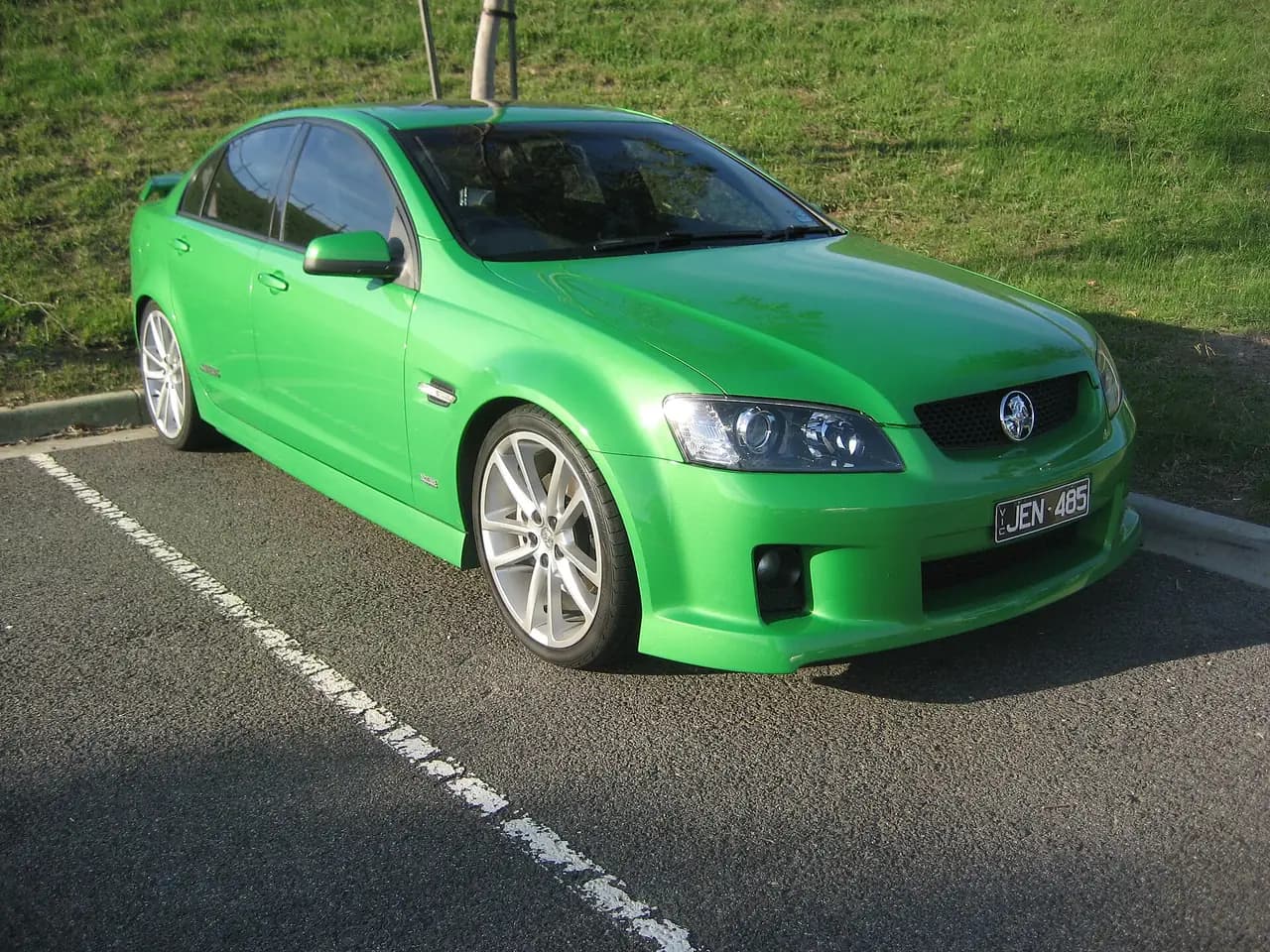 Bright green Holden Commodore SS (VE) sedan, front three-quarter view