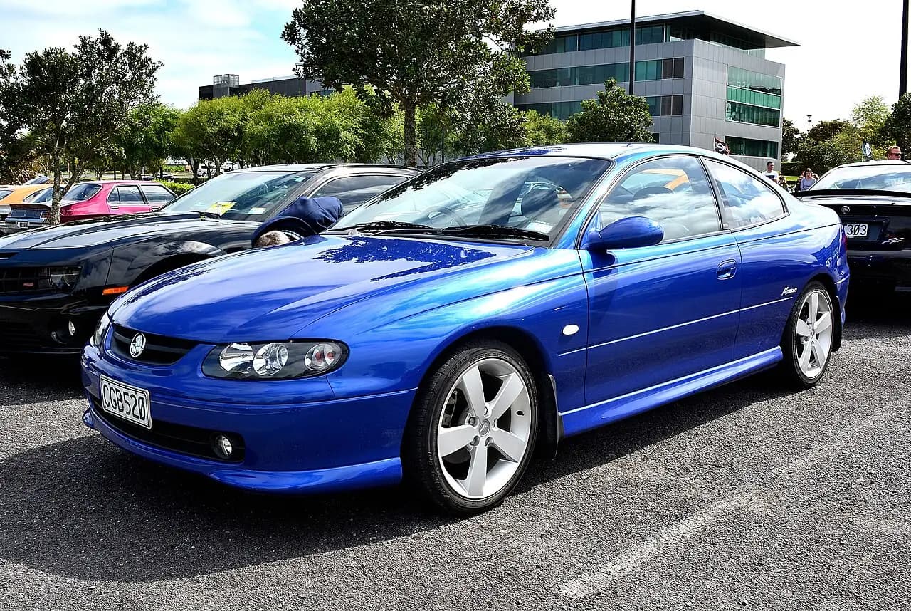 Blue 2004 Holden Monaro CV8 (V2) coupe, front three-quarter view