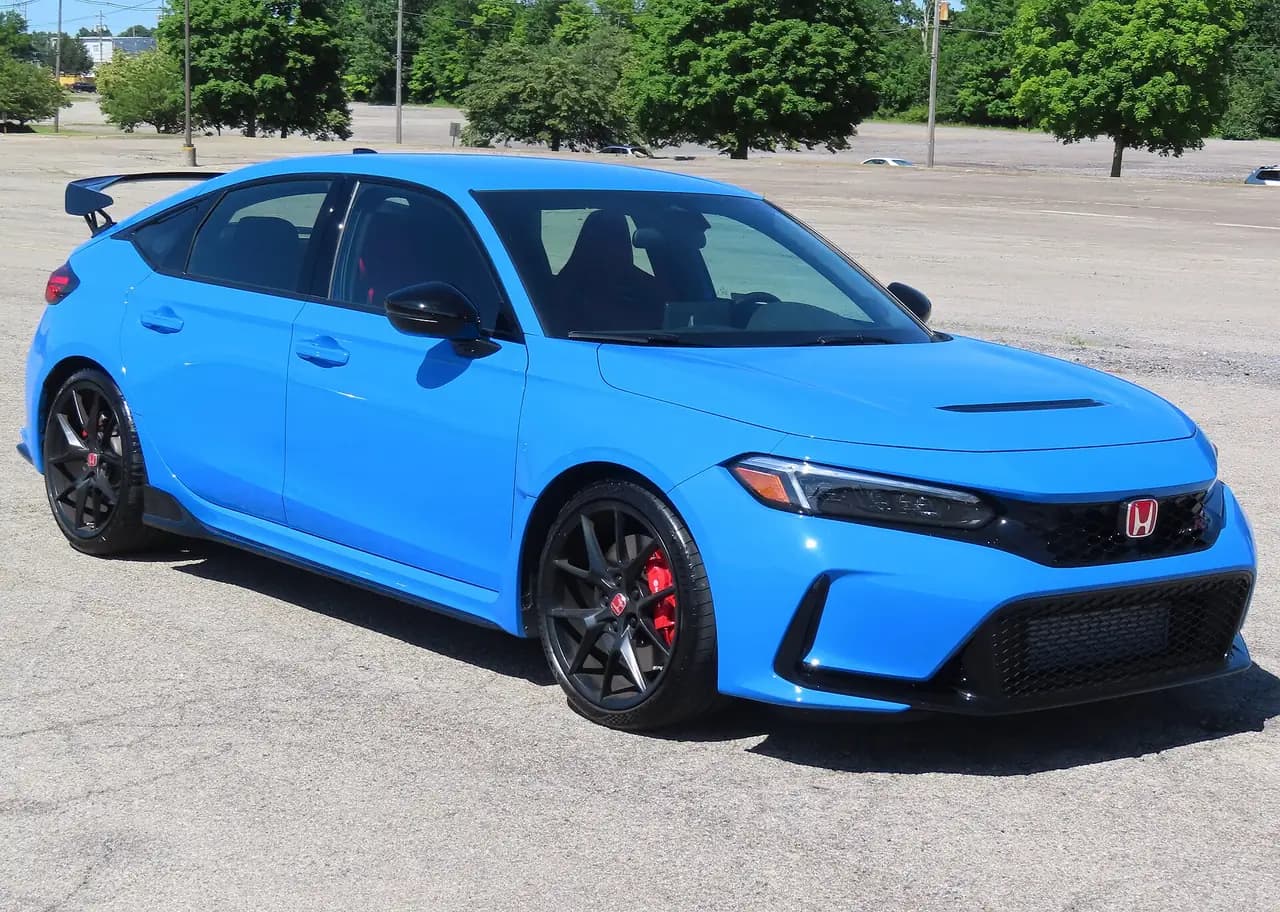 Boost Blue 2024 Honda Civic Type R (FL5) hatchback, front three-quarter view