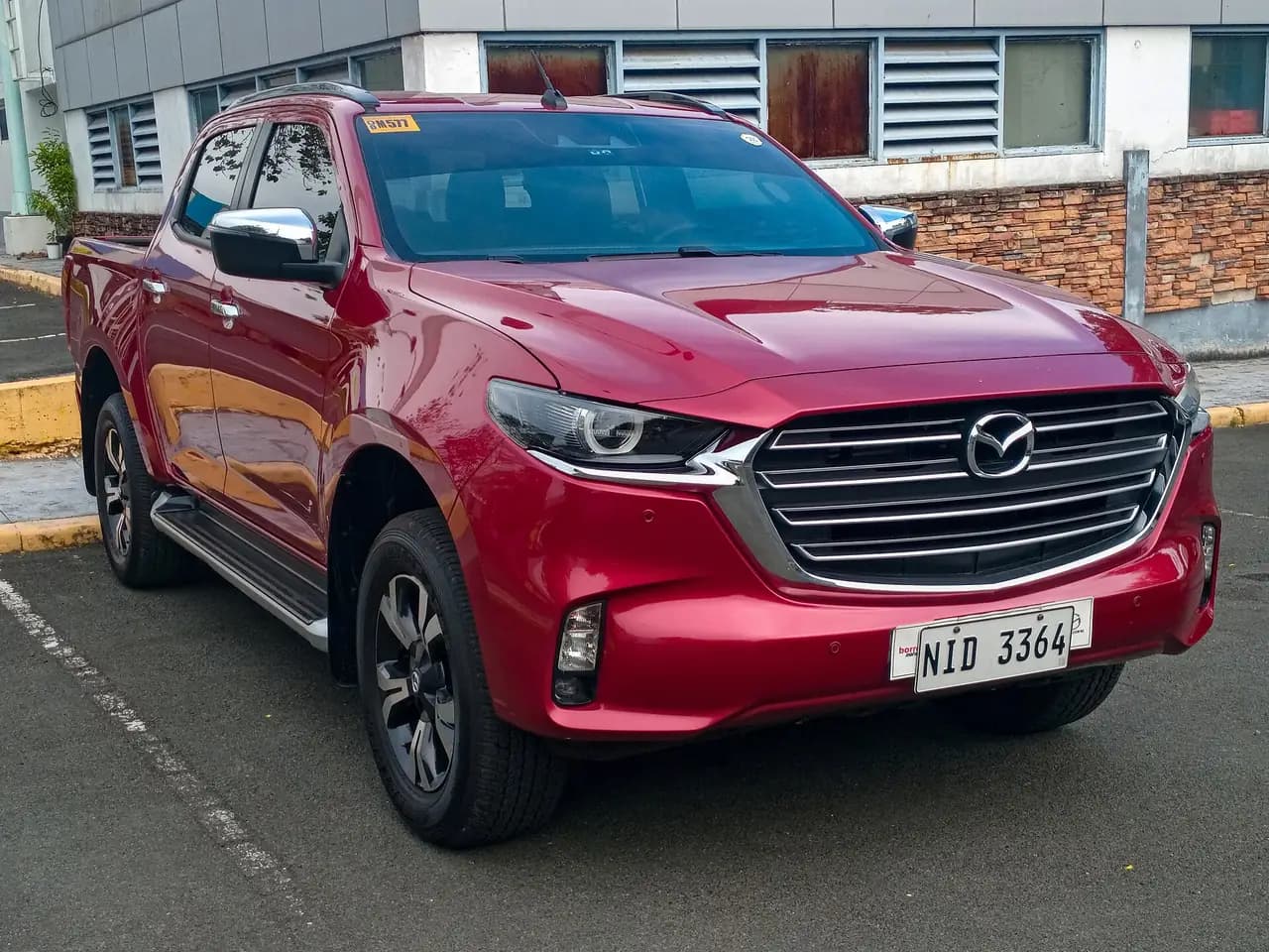 Red 2023 Mazda BT-50 (TF) 3.0 dual-cab 4x4, front three-quarter view