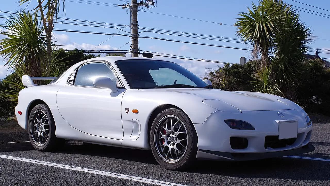 White 2002 Mazda RX-7 Spirit R Type A (FD3S Series 8) coupe, front three-quarter view