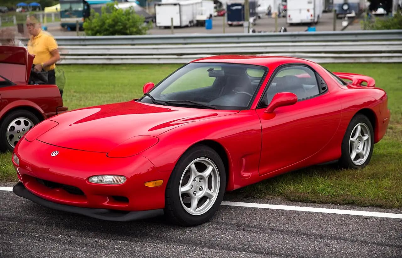 Red 1994 Mazda RX-7 R2 (FD3S Series 6) coupe, front three-quarter view