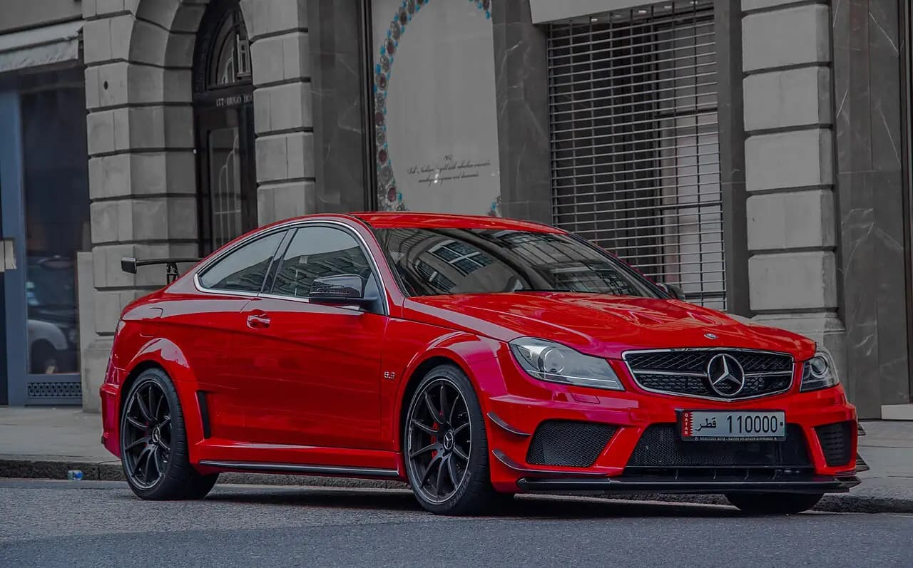 Red Mercedes-Benz C 63 AMG Coupé Black Series (C204) with rear wing, front three-quarter view