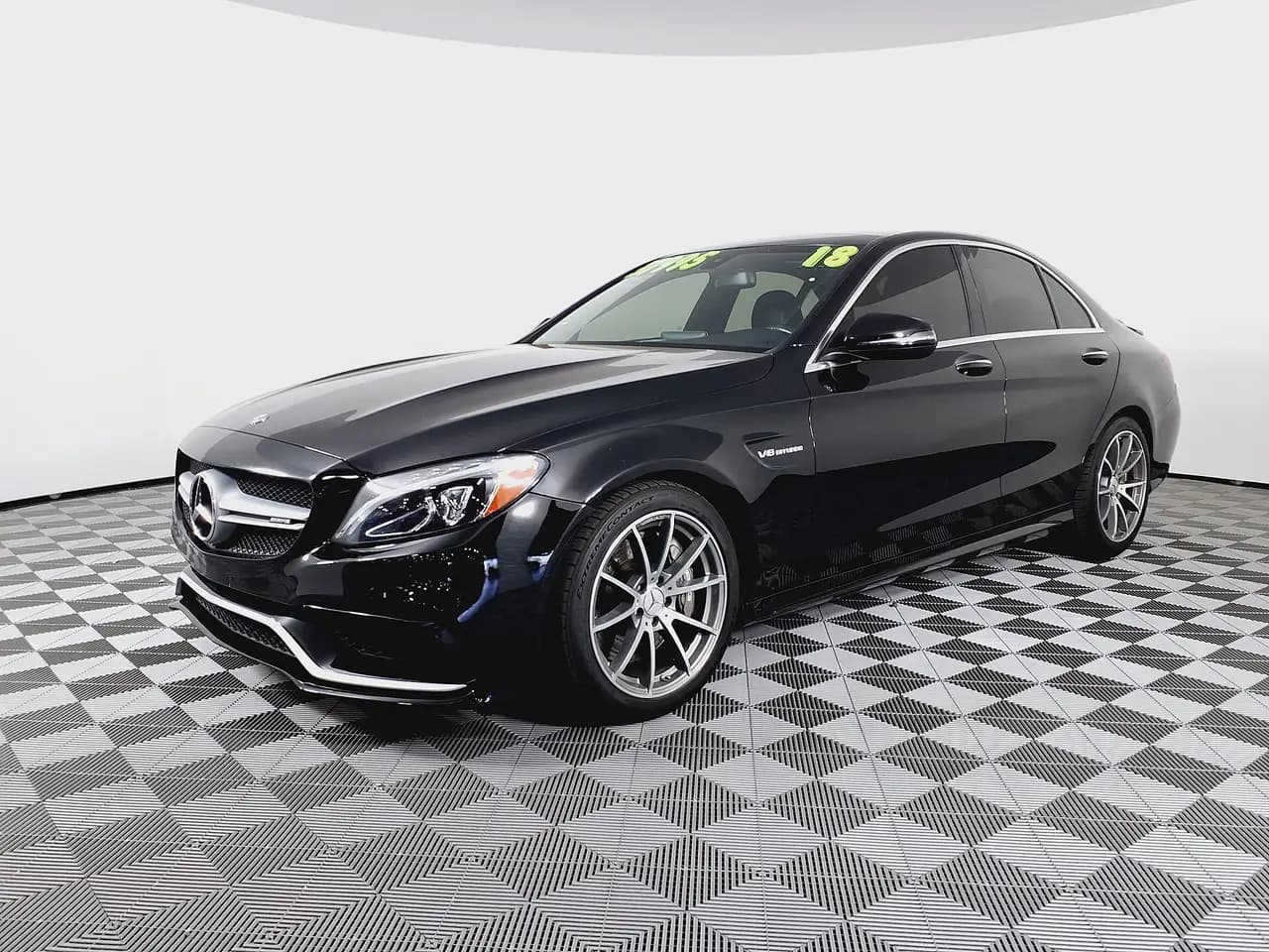 Black 2018 Mercedes-AMG C 63 sedan (W205), front three-quarter view