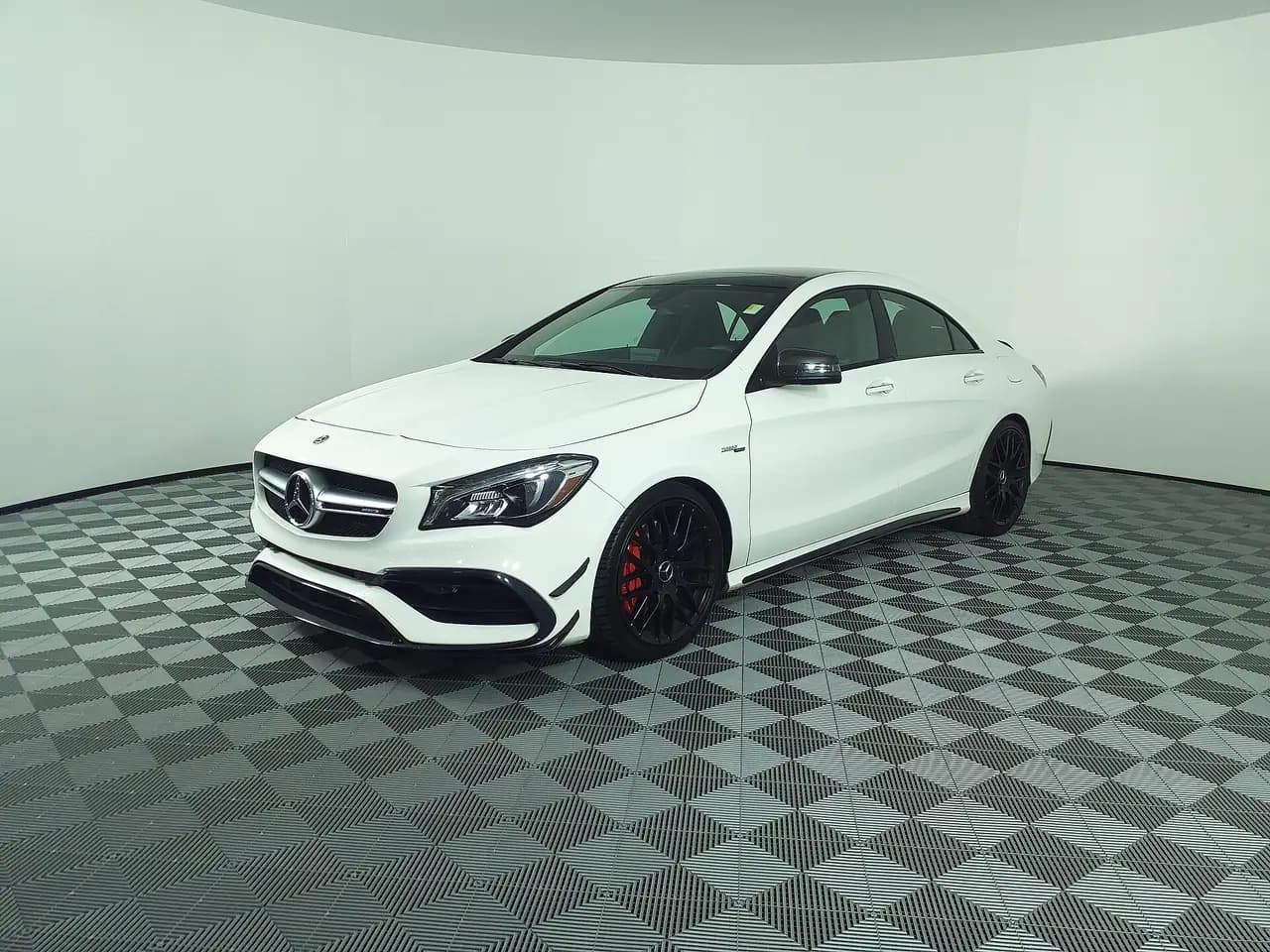 White 2018 Mercedes-AMG CLA 45 4MATIC coupe (C117 facelift), front three-quarter view