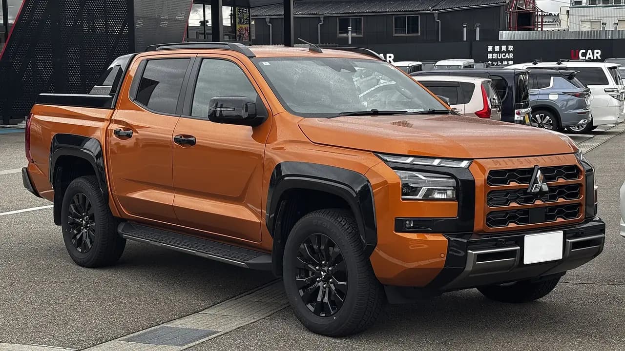 Orange 2024 Mitsubishi Triton GSR double cab (MV), front three-quarter view