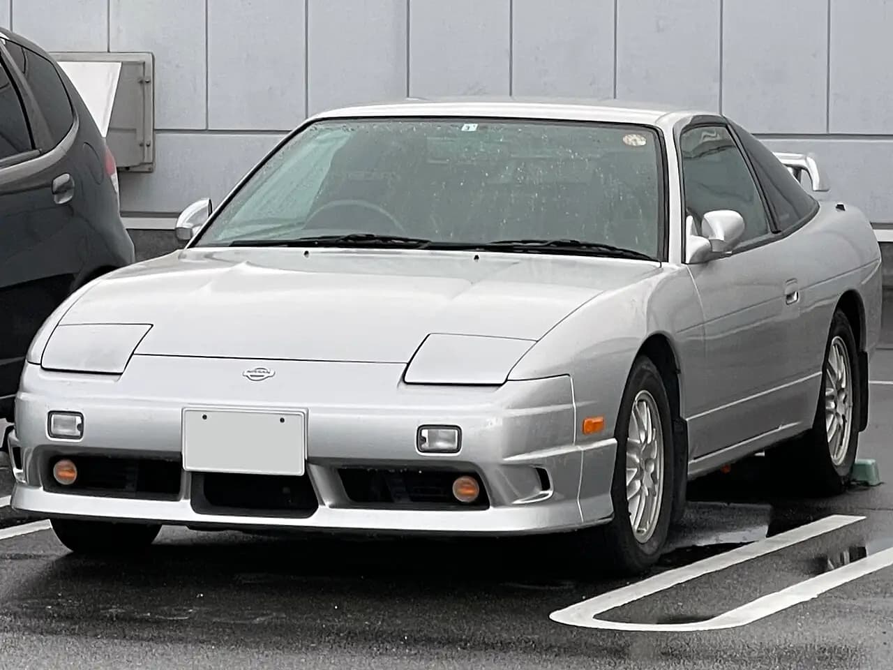 Silver Nissan 180SX Type X (RPS13 kouki) hatch, front three-quarter view