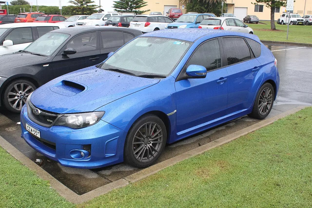 Blue 2012 Subaru Impreza WRX hatchback (GR), front three-quarter view