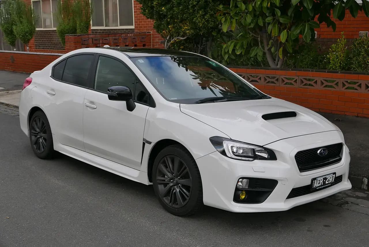 White 2015 Subaru WRX Premium sedan (VA), front three-quarter view