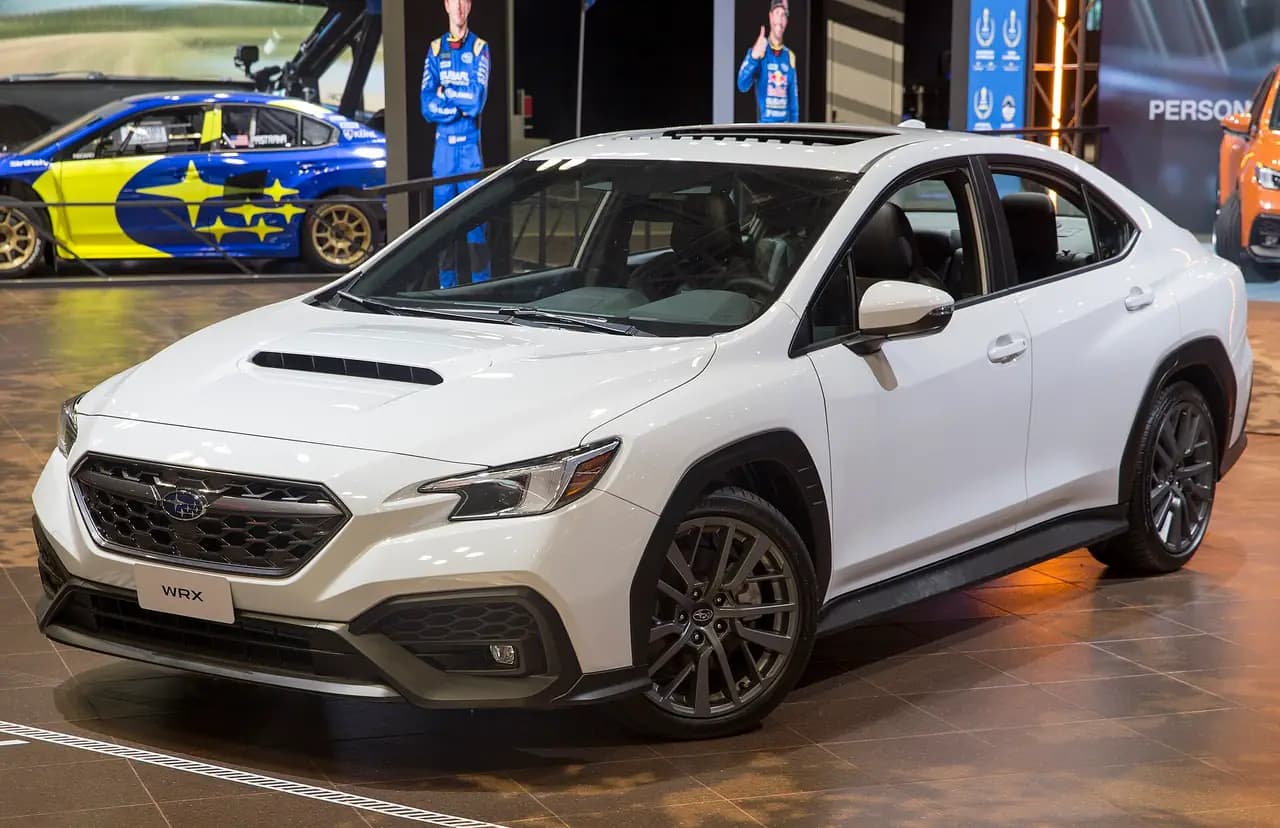 White 2022 Subaru WRX GT sedan (VB) at the New York auto show, front three-quarter view