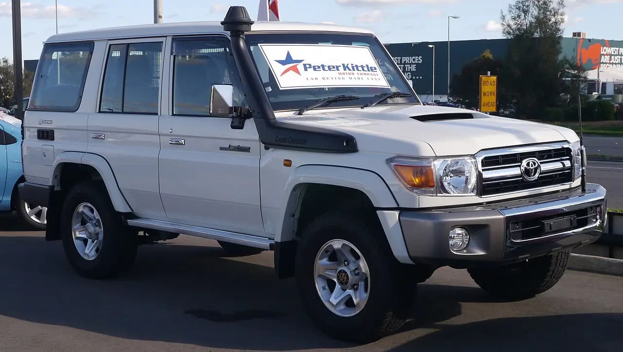 White 2015 Toyota LandCruiser 76 Series (VDJ76R) GXL wagon with snorkel, front three-quarter view