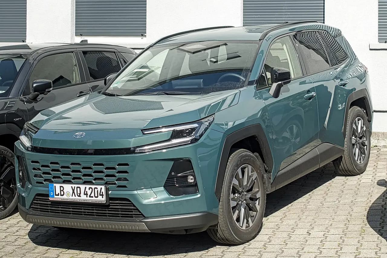 Teal Toyota RAV4 Hybrid (XA60), front three-quarter view