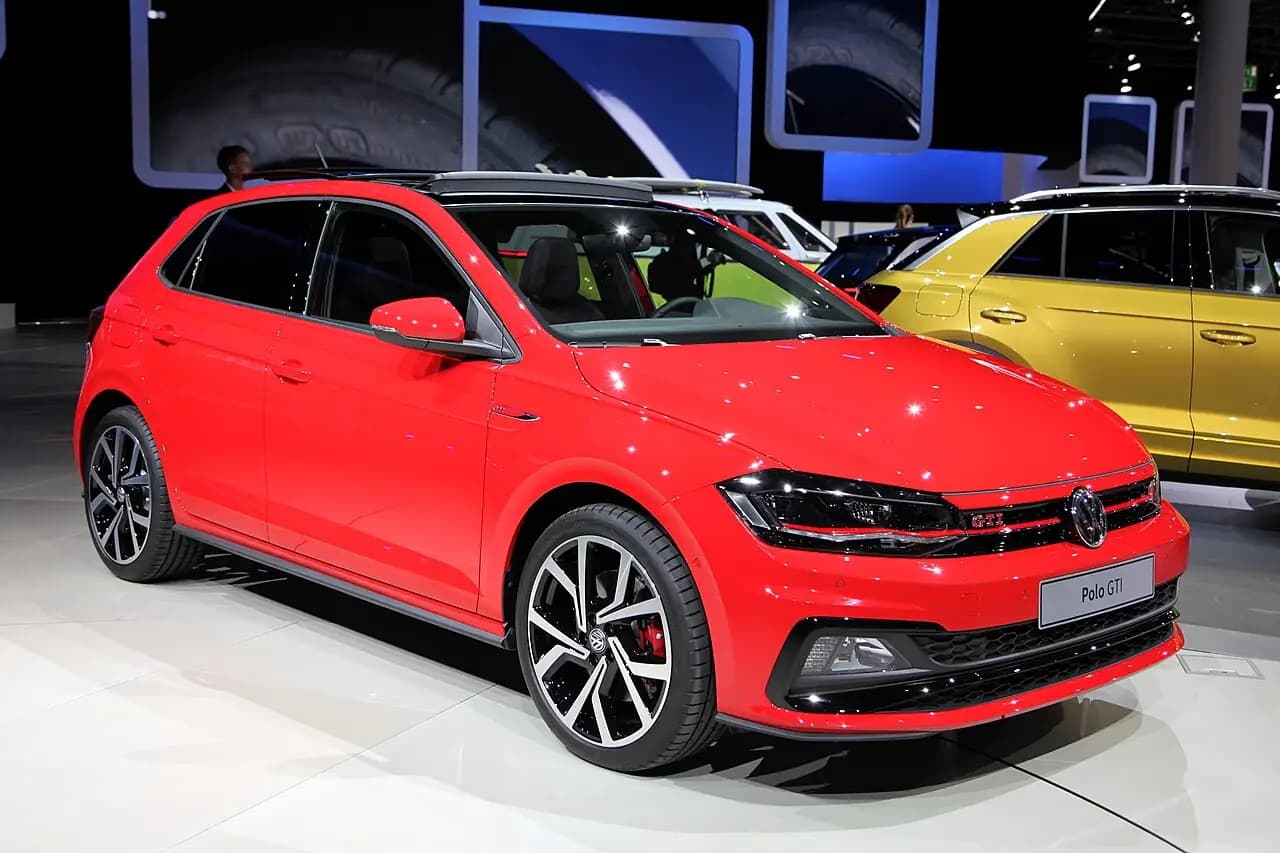 Red Volkswagen Polo GTI (AW, pre-facelift) hatchback at IAA 2017, front three-quarter view
